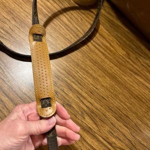 Louis Vuitton cross body strap 56 inches. There is room to make smaller